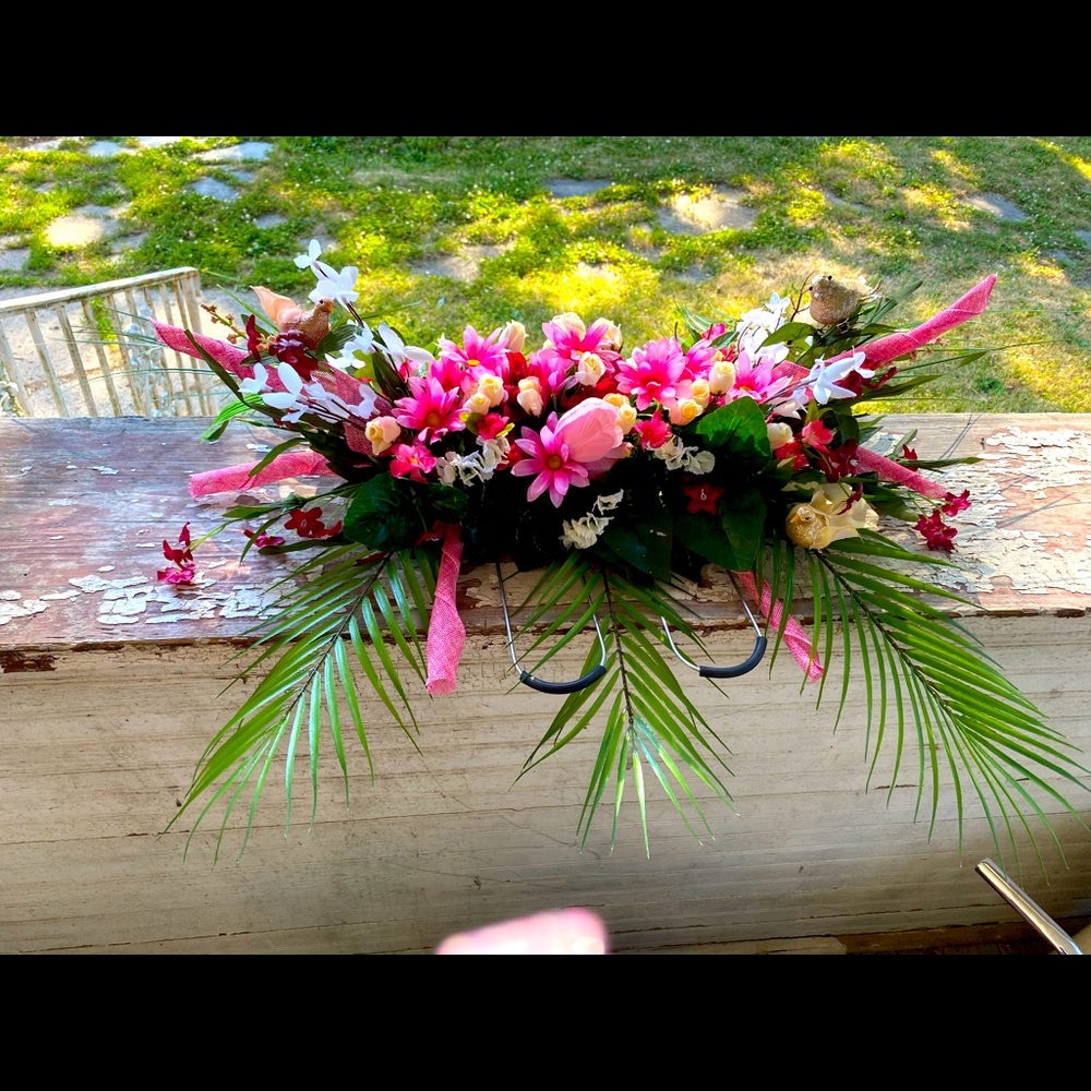 Pink and white flower with birds headstone saddle